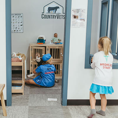 Two girls playing veterinarian